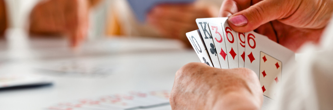 A group of people playing cards