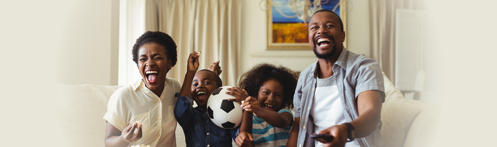 a family enjoying tv together despite differing levels of hearing ability